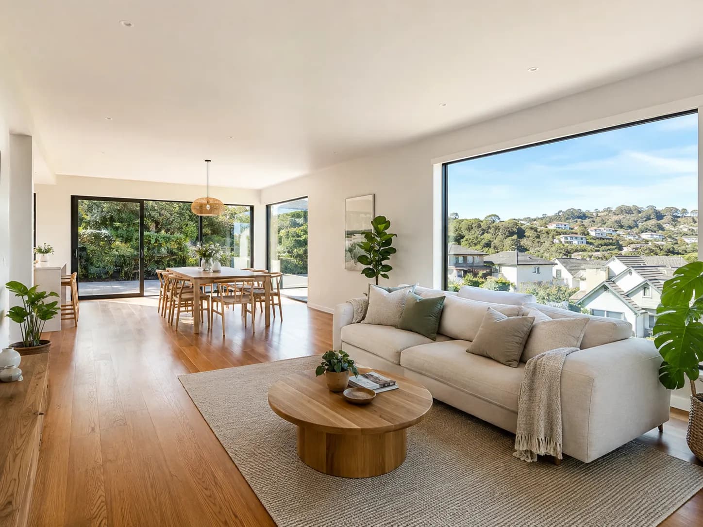 Bright open-plan living and dining room photographed for a property listing